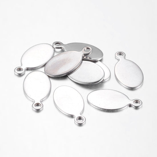 10 oval shaped silver jewelry stamping tags
