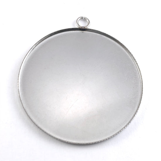 round silver colour pendants that are cabochon trays