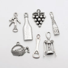 set of various jewelry charms that are wine themed