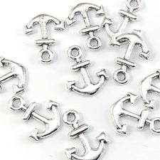silver colour jewerly charms shaped like anchors