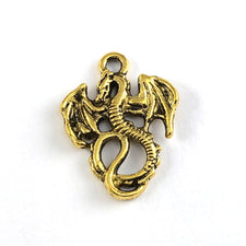 Antique gold coloured jewerly pendant that looks like a dragon