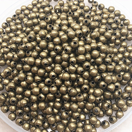 bowl of round bronze metal beads