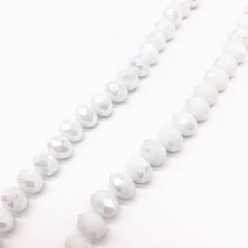 strands of shiny white glass beads
