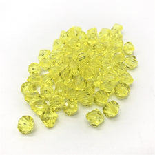 pile of yellow bicone shaped jewelry beads