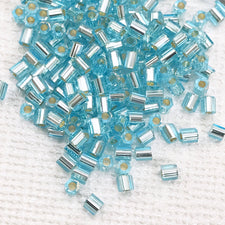pile of light blue glass beads