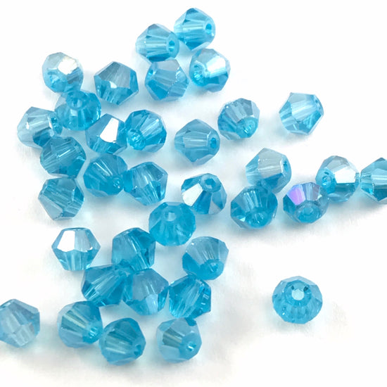aqua marine colour beads in a bicone shape