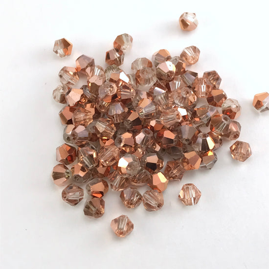 rose gold colour bicone shaped jewelry beads