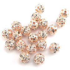 rose gold coloured round beads with rhinestones