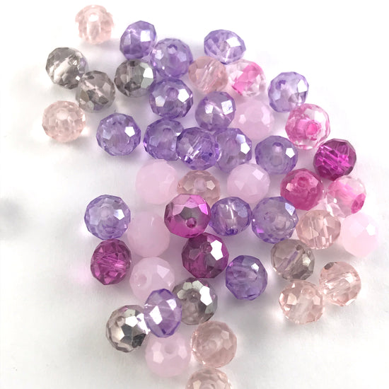 mixture of different shades of pink rondelle shaped jewerly beads