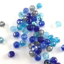 mixture of rondelle shaped jewerly beads in different shades of blue