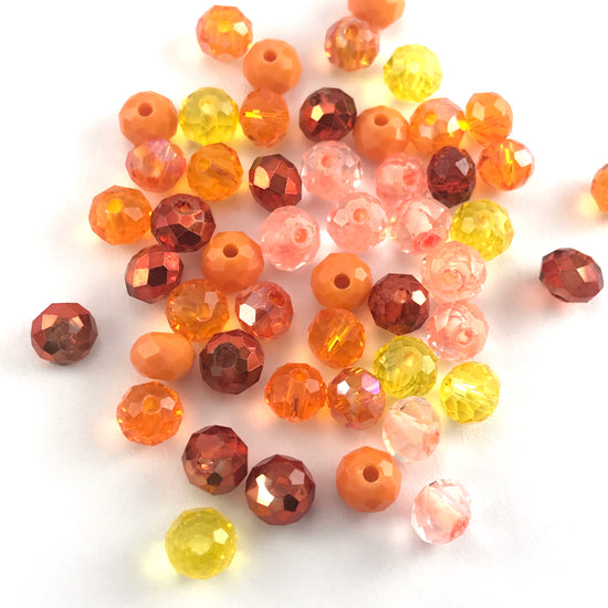 rondelle shaped jewelry beads in a mix of different shades of orange