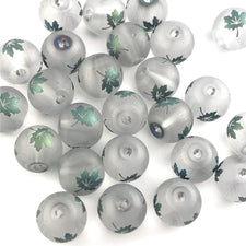 grey coloured beads with shiny green maple leaf embellishments