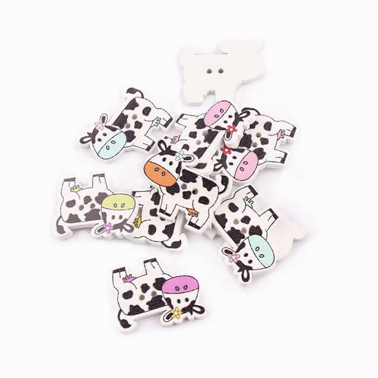 wooden buttons with cows printed on them