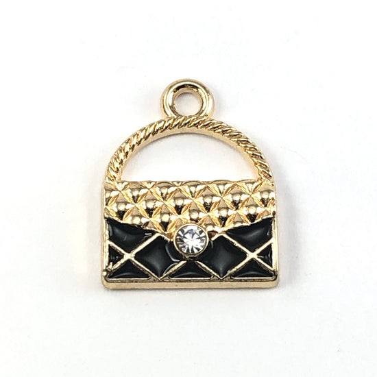Black and gold jewerly charms that looks like a purse