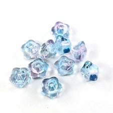 flower shaped beads that are clear with blue and pink accent colours
