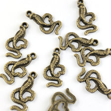 bronze jewerly charms that look like cobra snakes