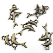 bronze colour jewerly charms that look like dolphins