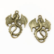 front and back of dragon jewelry pendants with antique bronze finish