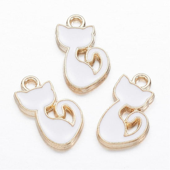 cat shaped jewelry charms that are white and gold