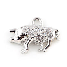 silver colour jewelry charms with rhinestones that look like pigs