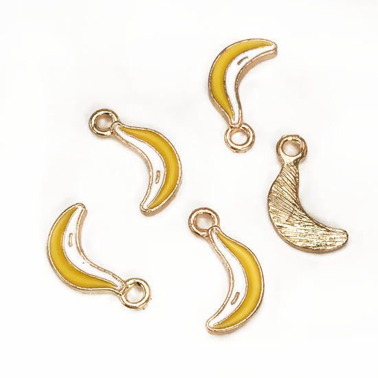 five jewelry charms that look like bananas