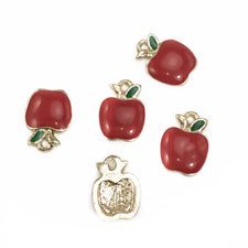 Five jewelry charms that look like red apples