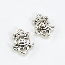2 silver jewelry charms that look like pigs