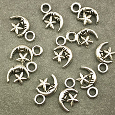 ten antique silver star and moon jewelry charms