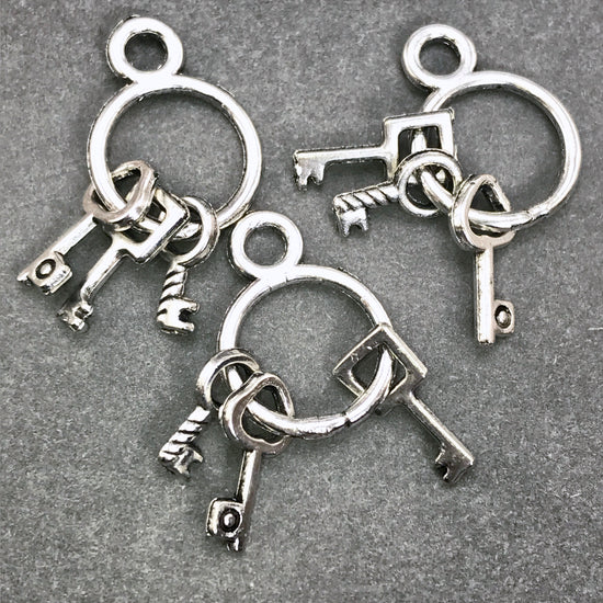 silver colour jewelry charms that look like a ring of keys 10 pieces