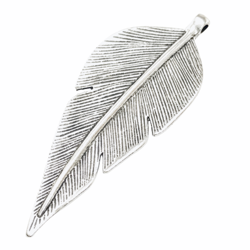 large silver jewelry pendant shaped like a leaf