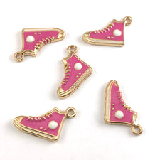 pink and gold jewerly charms that look like hightop running shoes
