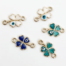 enamel jewelry charms that look like four leaf clovers