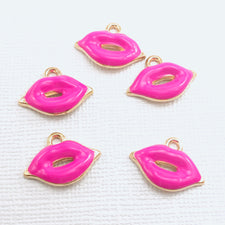 5 hot pink jewelry charms shaped like lips