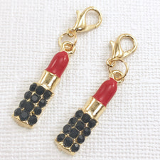 2 jewelry charms that look like tubes of lipstick