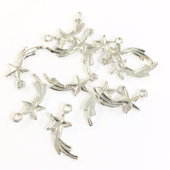 12 silver jewelry charms that look like shooting stars