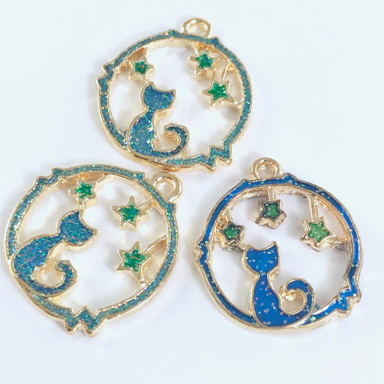 3 jewelry charms shaped like a hollow circle with cat and star shapes in the middle
