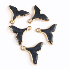 5 black enamel jewelry charms shaped like whale tails