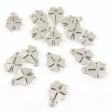 silver jewelry charms that look like four leaf clovers