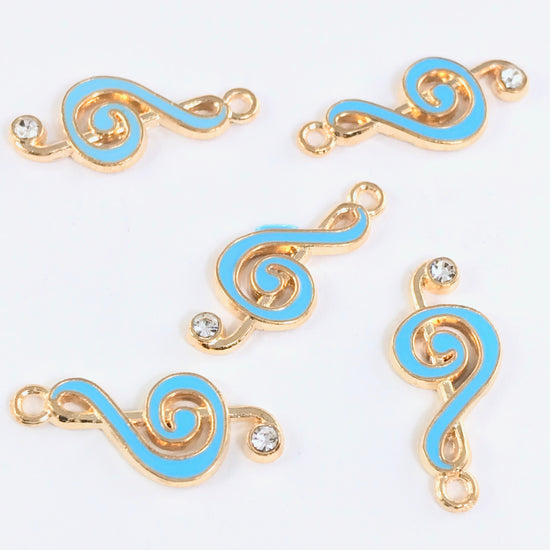5 blue and gold jewelry charms shaped like music notes