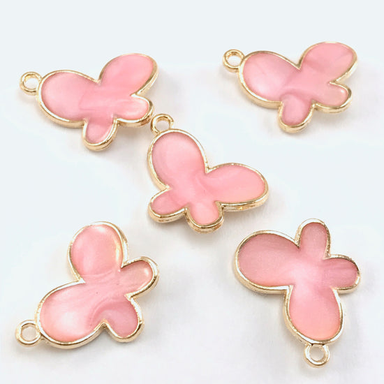 5 pink and gold jewelry charms shaped like butterflies