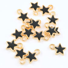 15 gold and black jewelry charms shaped like stars