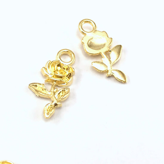 front and back of gold colour jewerly charm that looks like a rose