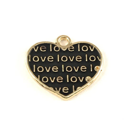 close up of black and gold jewelry charms shaped like hearts with the word love on them