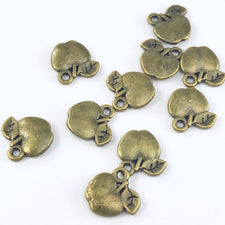 bronze colour jewerly charms shaped like apples