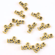 gold colour jewerly charms that say love