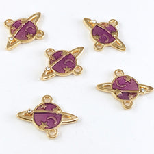 5 purple and gold jewelry charms that look like planets