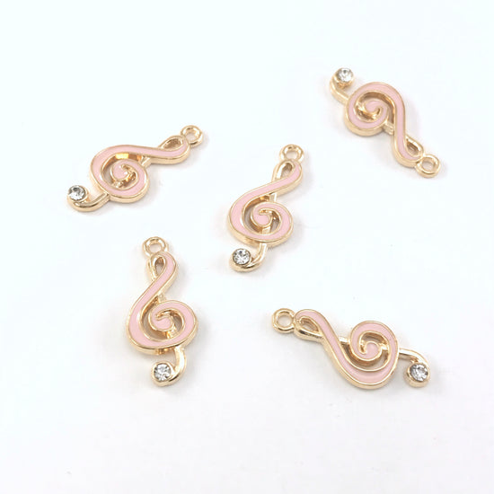 5 pink and gold jewelry charms that look like music notes
