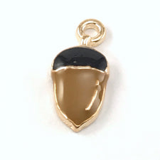 black and brown jewerly charm that looks like an acorn nut