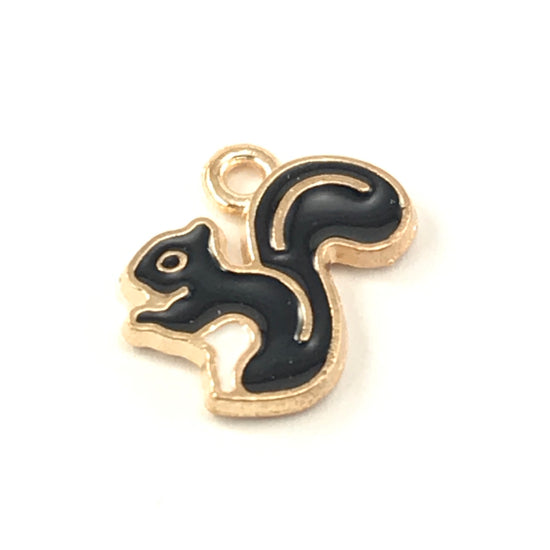 black and gold jewerly charm that looks like a squirrel