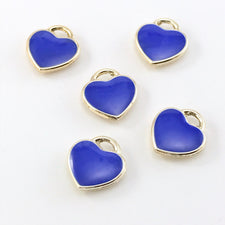 blue and gold jewely charms that are heart shaped